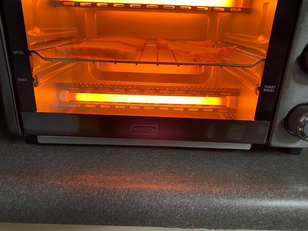 Dash Express Toaster Oven - Space-Saving Countertop Design - Versatile Use with adjustable temperature dial & Quick Heat-Up System - Dishwasher Safe Accessories - Bake, Broil & Toast - Black customer photo 1